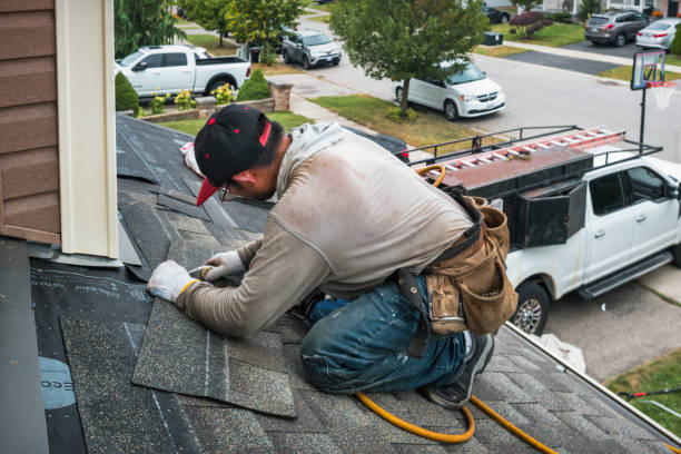 Professional Roofing technician working in Island Park, NY